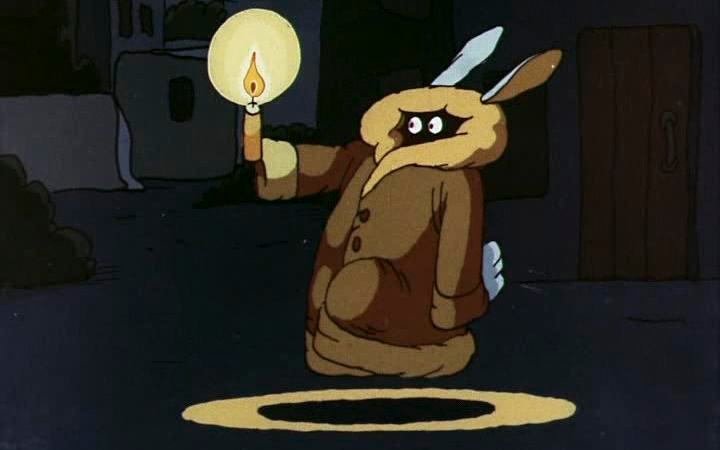 Кадр из фильма: «Ух ты, говорящая рыба!»,  кролик в пуховике держит свечку